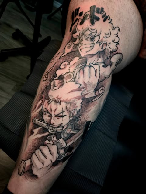 Two manga characters stacked vertically on an arm: a curly-haired character at top and a spiky-haired character below holding a weapon, rendered in black and grey ink.
