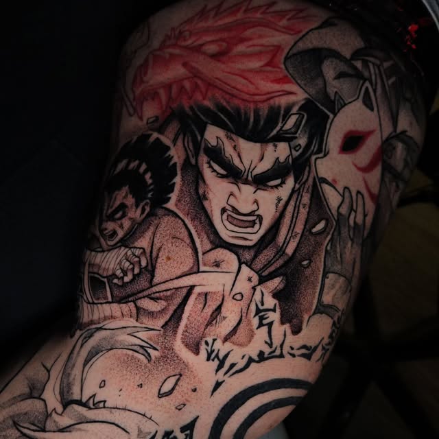 Angry character with red spiky hair and clenched fists tattooed on upper arm, with additional figures in background, predominantly black ink with red accents.