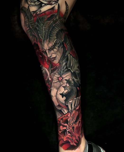 Full leg sleeve tattoo featuring a demonic horned figure with pale face and dark horns, surrounded by flowers and red flames, in color.