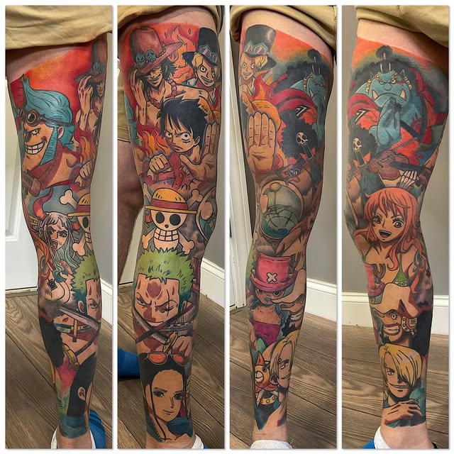 One Piece character sleeve tattoo covering full leg with Luffy, Nami, Sanji, and other crew members in vibrant orange, red, blue, and green tones.