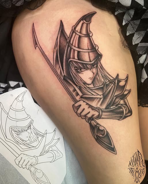 Wizard character with pointed hat wielding a curved sword on upper arm, rendered in black and grey ink with sketch visible below.