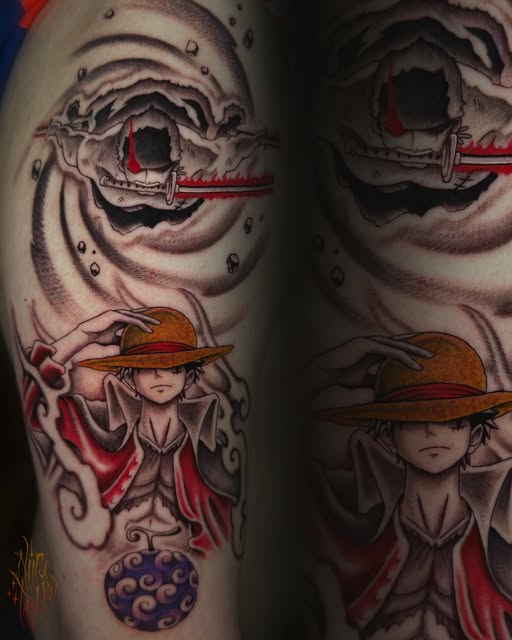 Anime character wearing brown hat and red cloak with large skull imagery above, purple orb below, tattooed on upper arm in red, black, and grey tones.