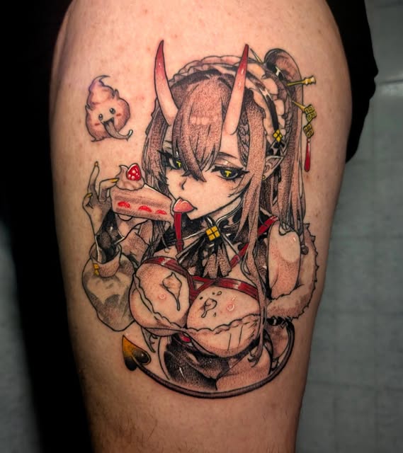 Anime character with horns and long hair eating cake, holding a small creature, tattooed on upper leg with red and black ink accents.