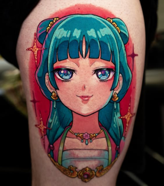 Anime girl character with teal twin-tails and blue eyes wearing gold jewelry on upper arm tattoo with red background.