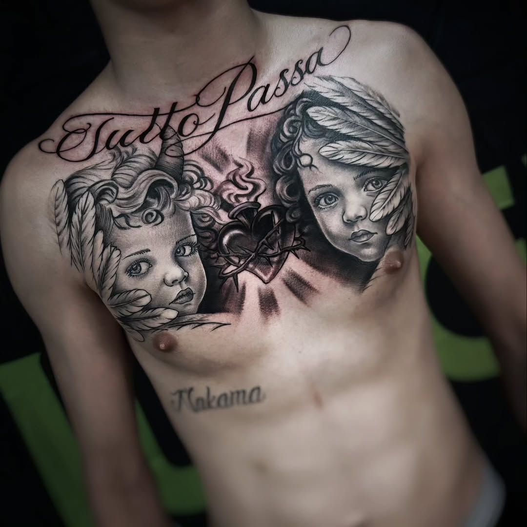 Chest tattoo featuring two child faces with feathers and horn, a sacred heart with thorns, and cursive script reading Tutto Passa.