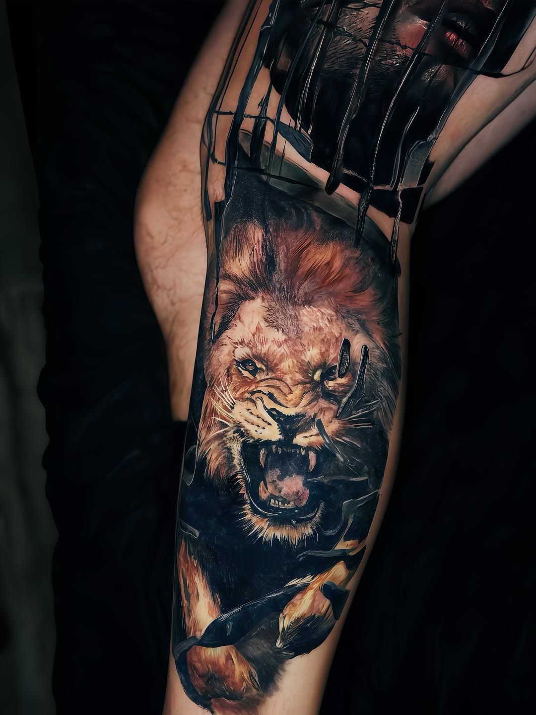 Roaring lion head with open mouth and intense expression on upper leg, rendered in photorealistic color with warm tones.