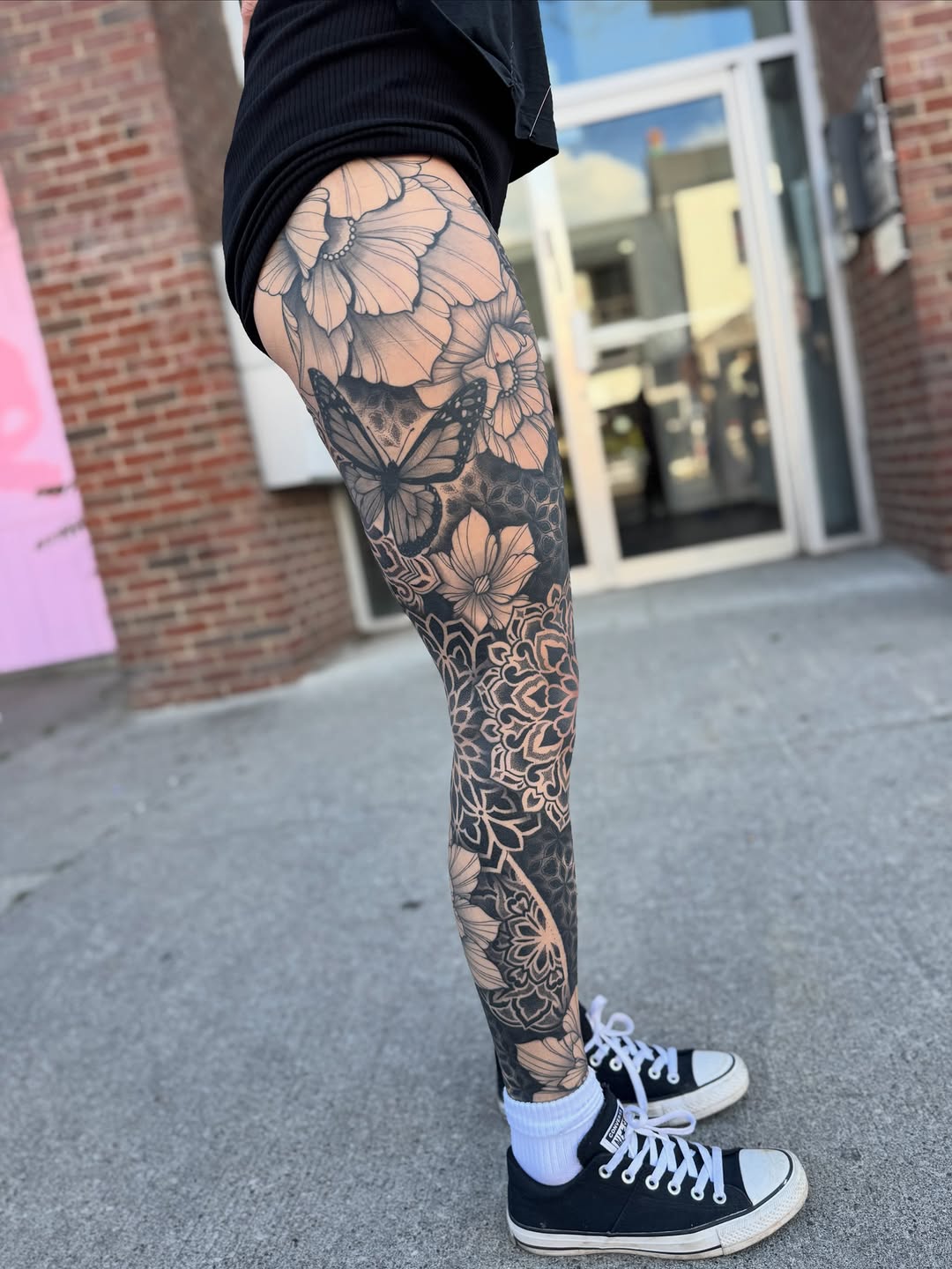 Full leg sleeve featuring ornamental mandala patterns, butterflies, and floral designs with symmetrical geometric linework.