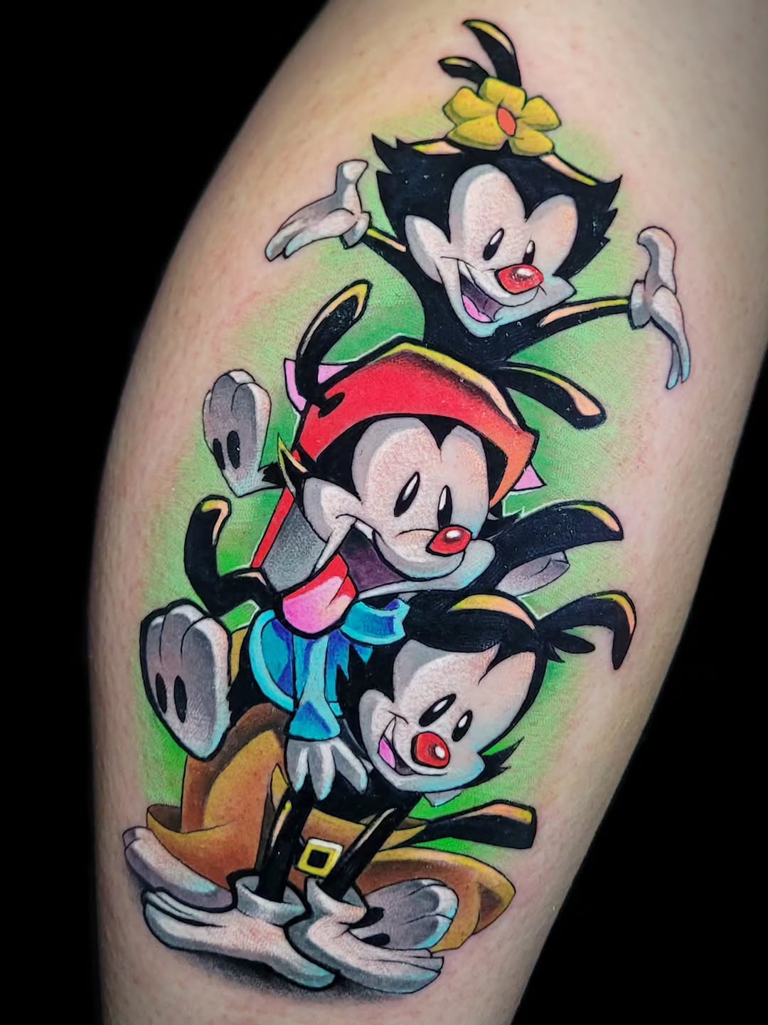 Stacked cartoon characters with exaggerated 3D proportions, vibrant saturated colors, and painted lighting effects on the calf.